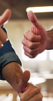 People, carpenter or team with thumbs up in workshop for good job, review or positive feedback. Group, carpentry or employees with like emoji, yes sign or OK for thank you or well done in wood store