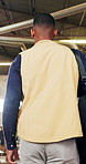Back, man and walk in warehouse for carpentry, inspection and stock check for production. Thinking, male person and carpenter in factory for evaluation, quality assurance and manufacturing furniture