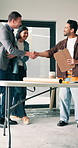 Happy, couple and handshake with contractor for building maintenance, renovation or partnership. Man, woman or shaking hands with home designer for construction design, agreement or deal in house