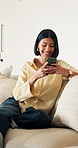 Laugh, texting and woman on sofa with phone, digital communication and comic post on social media. Contact, typing and happy person in house with tech, funny message and meme reaction on chat app.