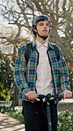Man, student and scooter outdoor for travel, university and helmet at campus for education. Person, riding and journey at park with electric transport, morning commute and eco friendly for learning