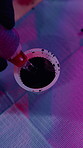 Tattoo, ink cap and hands of person in parlor to prepare for artwork, design and body modification. Shop, aesthetic and artist with machine, pigment and tools for permanent art, service and start