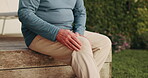 Hands, knee pain or senior person in backyard with discomfort, strain or osteoarthritis at home. Elderly man, leg injury and outdoor at house with muscle tension, joint pressure or ache in retirement