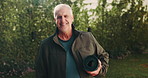 Yoga mat, fitness and face of senior man in nature with confidence for exercise, health or wellness. Morning, happy and portrait of elderly person with equipment for pilates, calm or relax in park.