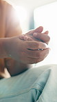 Stress, person and hands with anxiety in home for emotional trauma, mental health or disorder. Closeup, lens flare or nervous with grief, difficult challenge or bad habit for anticipation or feeling