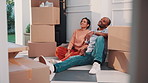 Couple, relax or thinking with boxes in new home for relocation, planning or renovation ideas. Man, woman or talking with packages or decor for DIY interior design, property change or moving in house