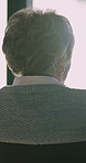 Elderly, woman and thinking with wheelchair by window in retirement home for sunshine, forget or memory. Thoughtful, relax and calm old person with disability and dementia by back, view or house