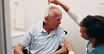 Caregiver, comb and old man in wheelchair with hair care, support and assistance with conversation. Healthcare worker, discussion and elderly person with disability, hairstyle or help in nursing home
