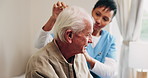 Help, old man and caregiver with haircare in home for homecare, grooming or patient care. Beauty, senior person or carer with comb in assisted living for scalp health, hairstyle or retirement support