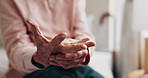 Hands, old man and discomfort in home with wrist pain, parkinson and symptoms of carpal tunnel. Senior person, massage or inflammation in bedroom with sore joints, pinched nerves and muscle stiffness