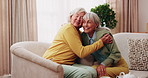 Smile, old women and friends at house with hug, welcome and bonding together for reunion. Happy, senior people and talking in lounge with embrace, friendly affection and compassion for weekend visit