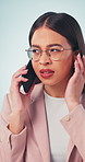 Confused, business and woman in studio with phone call, bad signal and faulty speaker. Concern, female person and listening with mobile malfunction, low volume and internet issues on white background