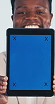 Face, green screen and tablet with happy man in studio for advertising or marketing opportunity. Display, mockup space and tech with black person on white background for information or presentation