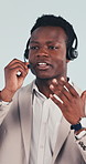 Call center, headset and black man with help, contact us and investment advice in crm service. Talking, guidance and finance consultant with mic, online banking and loan support on studio background.