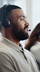 Headset, man and call center agent in office for communication, contact or help desk. Happy, mic and technical support consultant with online consultation for customer service or inbound discussion.