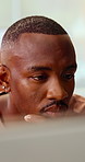 Reading, creative and business man on tech for strategy, planning and website for digital marketing. Office, online and African person on computer for brand promotion, email campaign and research