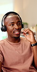 Office, talking and man with headset for customer support, online help and contact us. Consultant, happy and African person with mic for virtual assistance, crm service and client communication
