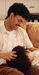 Happy, couple and head massage on home sofa with love, connection and support or care. Man, woman or people with glasses on lounge couch with comfort, pamper and kindness with communication in house