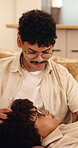 Relax, couple and talking on home sofa with head massage, connection and support or care. Man, woman or people with glasses on lounge couch with comfort, pamper and smile for communication in house