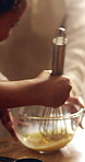 Hands, parent and child with mixing for baking, cake process and teaching family recipe in home. Person, kid and whisk with raw ingredients for cookies preparation, culinary development and bonding