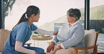 Caregiver, support and holding hands with senior woman in nursing home, care and healthcare service. Assisted living, nurse and empathy for elderly person, trust and compassion with gesture in house