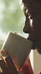 Thinking, relax and black woman at house with coffee, start day and mindset for nostalgia memory. Serious, mature person and beverage in home with reflection, daydreaming and reminiscing for wellness