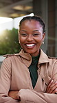 Realtor, face and black woman in town with arms crossed, broker and ambition as property investor. Happy, wind and real estate consultant with confidence, leasing agent or about us in housing market.