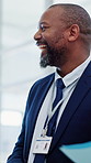 Laughing, doctor or black man with medical advice in hospital for friendly discussion or conversation. Male person, healthcare worker or talking with smile in meeting for social chat in building