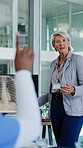 Doctor, woman and question with x ray screen in meeting for medical query or . Mature, female person or healthcare worker with hands raised, display or CT scan for interaction or answer in conference