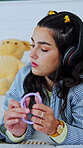Sensory, study or university student on bed with toy, regulation or stress relief in stimulation. Wellness, tech or woman in house with nerves, academic anxiety or mindful movement with calming tool.