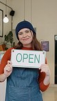 Hospitality, face and woman in restaurant with open sign, notice and welcome to small business. Portrait, poster and happy owner with billboard, service ready and greeting display for cafe startup.