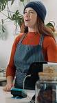 Tablet, happy and barista by counter in cafe for checkout, order or customer service at small business. Woman, hospitality and waitress with digital technology for transaction in coffee shop.