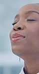 Black woman, face and breathe in office for relax, stress management or self control in business. Closeup, calm and happy African person with smile in mindfulness, relief or satisfaction or peace