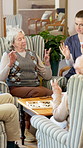 Retirement, nurse or old people with finger exercise, hand mobility or healthy aging in lounge. Support, senior group or caregiver with joint relief, arthritis care or rehabilitation in nursing home.