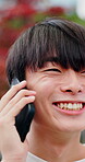 Phone call, laugh or college student in city with connection, funny chat or online joke on commute. Happy, digital or Asian man with tech, university contact or humor communication in urban travel.