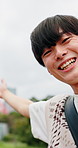 Face, Asian man and smile in city for selfie, recording video and travel blog with live streaming. Influencer, excited and outdoor for photography POV, landmark excursion and holiday vlog in Japan