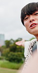 Face, Asian man and talking in city for live streaming, recording video and travel blog with selfie. Influencer, happy and outdoor for photography POV, landmark excursion and holiday vlog in Japan