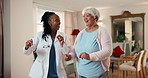 Dance, doctor and senior woman in nursing home with energy, happiness and celebrate good news. Healthcare worker, old person and fun in elderly care facility with physical therapy and fitness