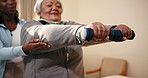 Physio, help and elderly woman with dumbbells for exercise, strength and rehabilitation in clinic. Healthcare worker, senior person and lifting weights for physical therapy, arm mobility and support.