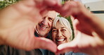Heart hands, love and face of old couple outdoor for romantic connection, support and bonding. Partner, trust and commitment gesture with senior man and woman in backyard of home for loyalty