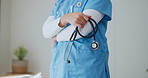 Hands, nurse and person with stethoscope, arms crossed and heart health at nursing home. Medical worker, cardiology equipment and woman with confidence, pulmonary healthcare or wellness with homecare