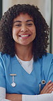 Pride, face or nurse in hospital with arms crossed, wellness service or ambition in medical career. Happy, portrait or woman with confidence, clinical practitioner or about us in healthcare industry.