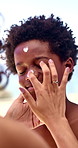 Mother, child and sunscreen on face for holiday, sunburn prevention and UV protection or skin damage. African family, woman and spf lotion application on boy for summer swimming, skincare or wellness
