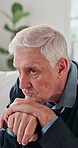 Thinking, unhappy and old man in home with walking stick, memory loss or reflection on past mistake. Mental health, regret and elderly person with disability, alzheimer or sad flashback in retirement