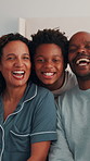 Hug, face and parents with kids in home for bonding, happy relationship and connection in morning. Family, bedroom and portrait of children with mom, dad and laugh for affection, support and love