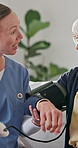 Nurse, happy and old woman with test for blood pressure, hypertension diagnosis and monitor heart. Caregiver, help and senior resident in nursing home for cardiovascular exam with smile for results