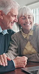 Finance, laptop and old couple hug in home together for online budget or retirement planning. Computer, financial review and good news with senior people in apartment for investment management