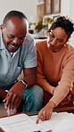 Documents, payment and African couple in living room for finance bill, debt or mortgage for discussion. Conversation, budget and man with woman for paperwork, asset management and talk in home