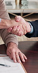 Property, sale or handshake in home with contract, offer acceptance or deal closing in meeting. Partnership, men or realtors with shaking hands, housing transfer or success in investment negotiation.