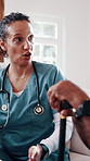 Nurse, discussion and sofa with senior in house for healthcare checkup or medical consultation. Woman, health worker or caregiver talking to elderly patient with cane for assisted living in home
